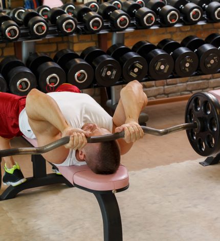 Fitness, bodybuilding. Powerful man during workout